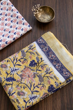 YELLOW WITH PEACH AND BLUE FLOWERS